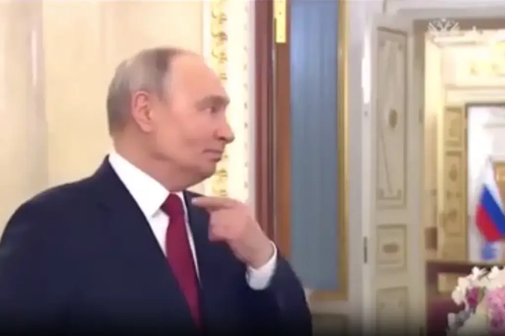 Putin gestured to his throat during the speech. Credit: Kremlin