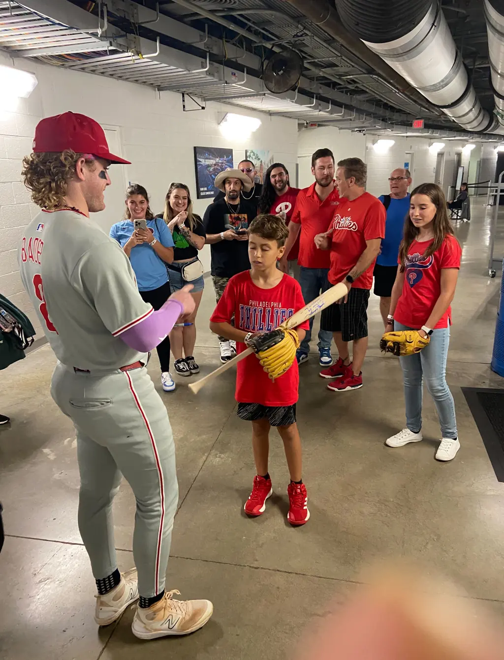The young boy got a signed bat from Harrison Bader after the game. Credit: X/Philadelphia Phillies