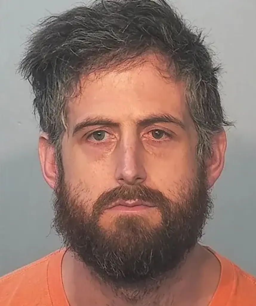 Christopher Michael Peden, 36, has been accused by police of cutting off his genitals and setting them on fire inside his mother’s detached garage. Credit: Allen County Indiana Sheriff's Department

