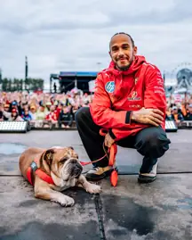 Lewis Hamilton and Roscoe. Credit: Formula 1/X