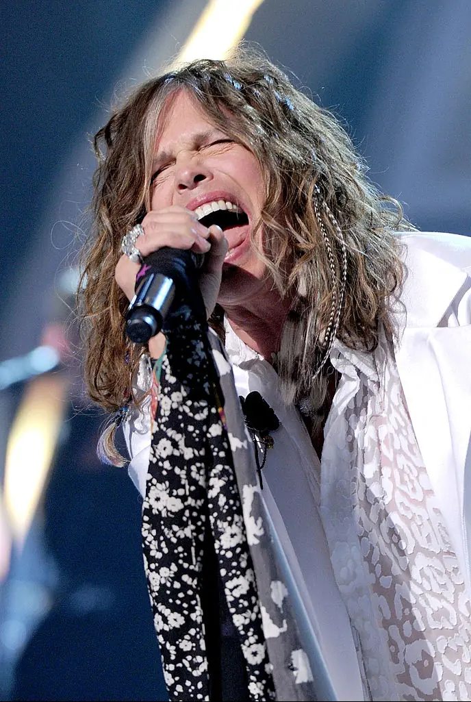 There's a reason why Tyler drapes scarves over his microphone. Credit: Kevin Winter/ACMA2011 / Getty