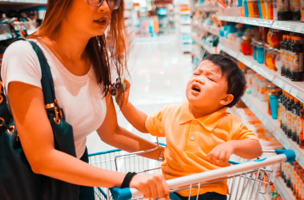 Many parents don't have the option to leave their kids at home, no matter how difficult they may make a shopping trip. Credit: Karl Tapales/Getty Images 