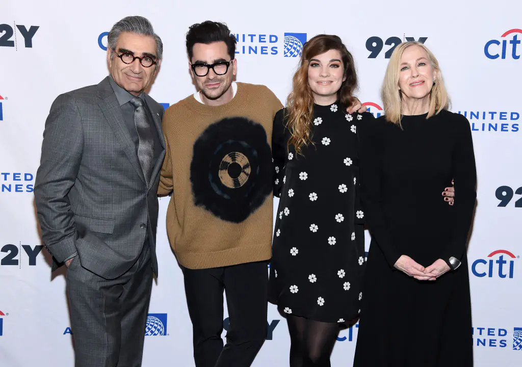Catherine O'Hara (right) with Eugene Levy (left), Dan Levy, and Annie Murphy. Credit: Jamie McCarthy / Getty