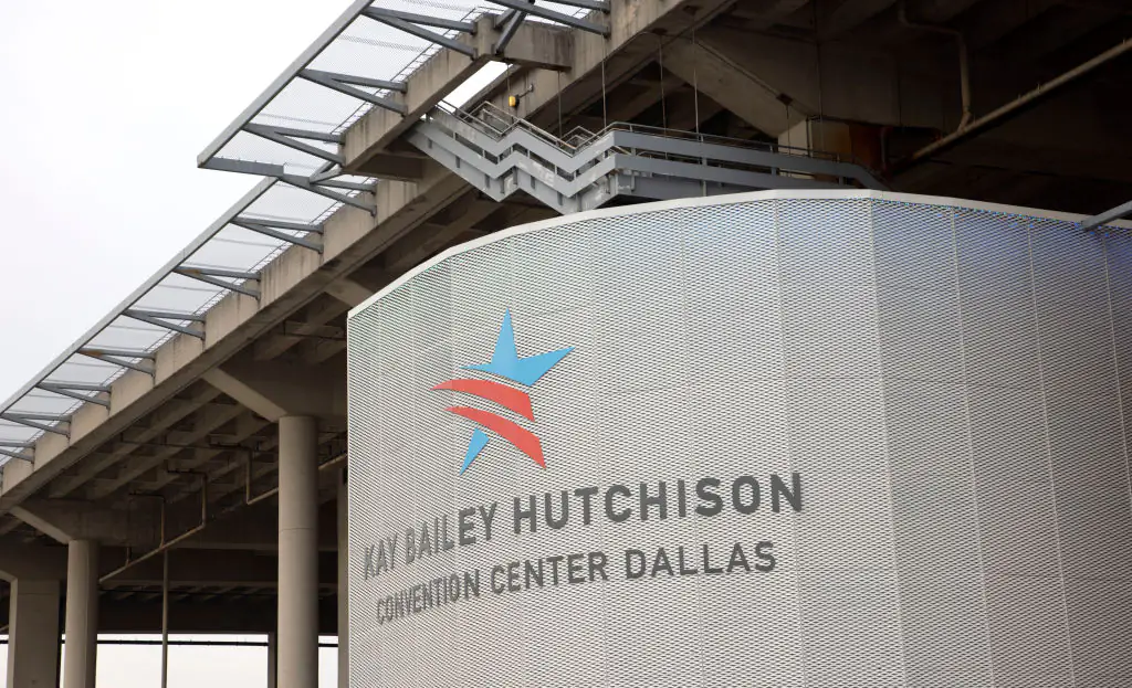 Hundreds of people were seen running from the Kay Bailey Hutchison Convention Center on Saturday. Credit: Ron Jenkins / Getty