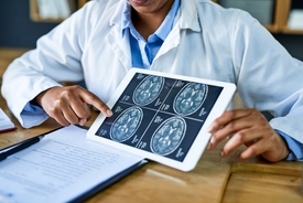 Doctor miraculously declared cancer-free after helping to develop treatment for his own terminal brain tumor