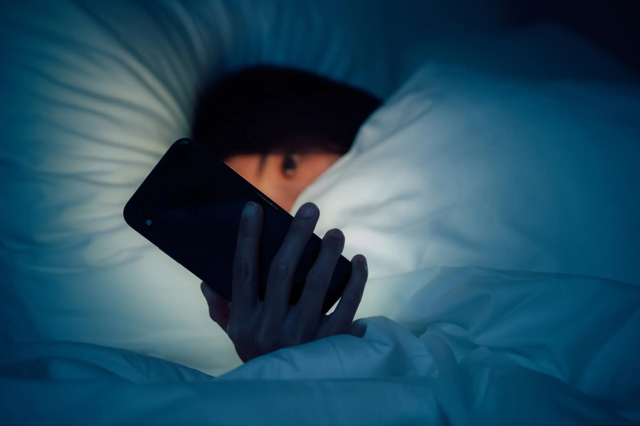 Using your phone in bed could seriously affect your sleep. Credit: Oscar Wong/Getty Images