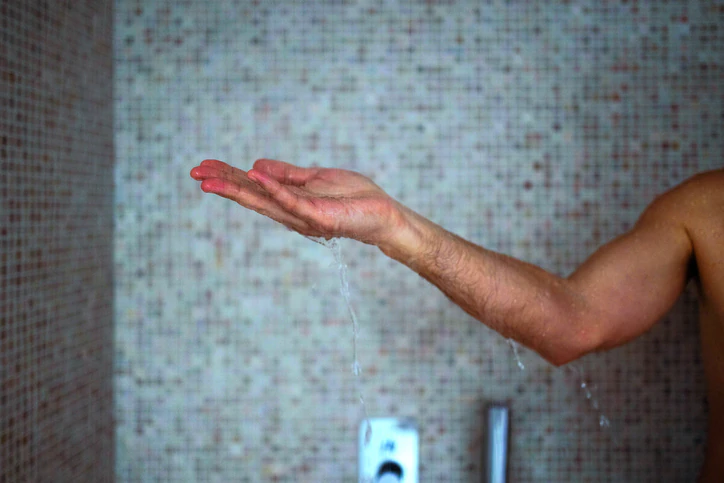 Would you brave a cold shower? Credit: ljubaphoto / Getty