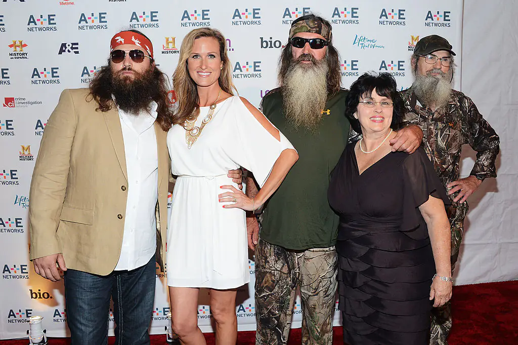 Phil Roberston (center) with Willie Robertson, Korie Robertson, Miss Kay Robertson, and Si Robertson. Credit: Jason Kempin / Getty