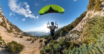 Terrifying moment YouTuber breaks his neck, back, and arm after falling 85 feet in paraglider crash