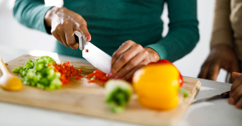 Clueless man is slammed for bringing cutting board to sick girlfriend's bed so she could 'help make dinner'