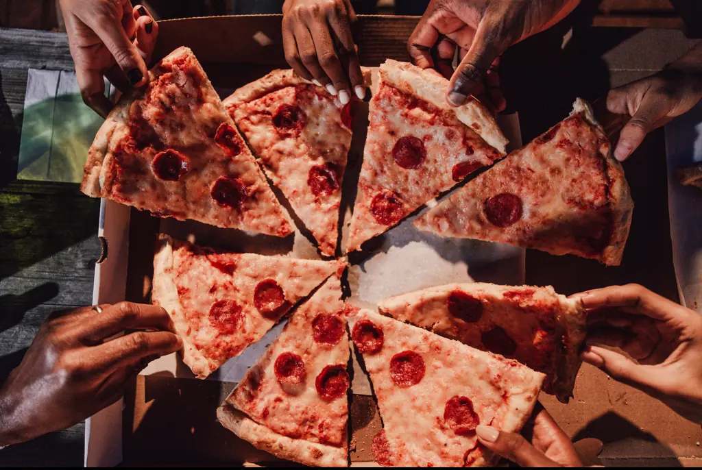 The guests appeared to be delighted by the pizza delivery. Credit: LeoPatrizi/Getty Images