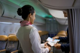 Flight attendant shares real reason cabin crew greet passengers as they board