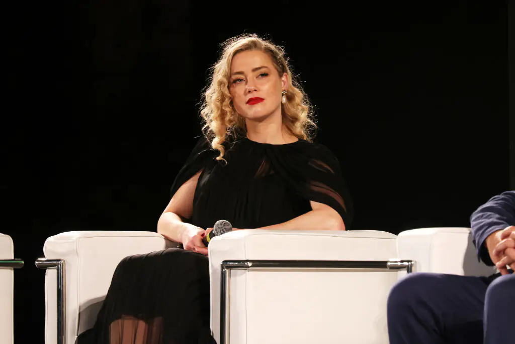 Amber Heard responds to reports that Johnny Depp has arrived in Spain where she's started a new life and 'changed her name'