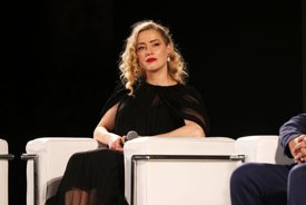 Amber Heard responds to reports that Johnny Depp has arrived in Spain where she's started a new life and 'changed her name'