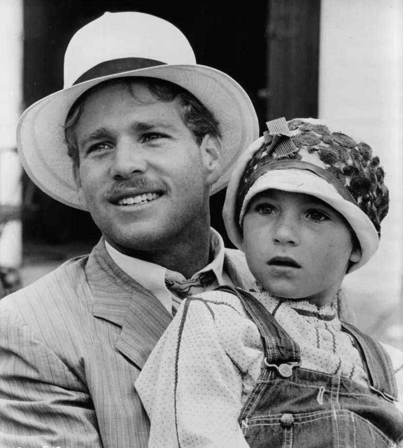 Ryan O'Neal holding Tatum O'Neal in a scene from the film Paper Moon (1973). Credit: Archive Photos / Getty