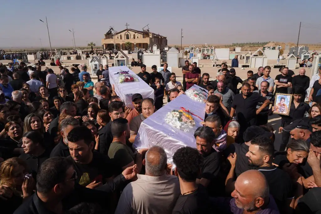 Funerals were held after the wedding fire. Credit: Ismael Adnan Yaqoob / Anadolu Agency / Getty