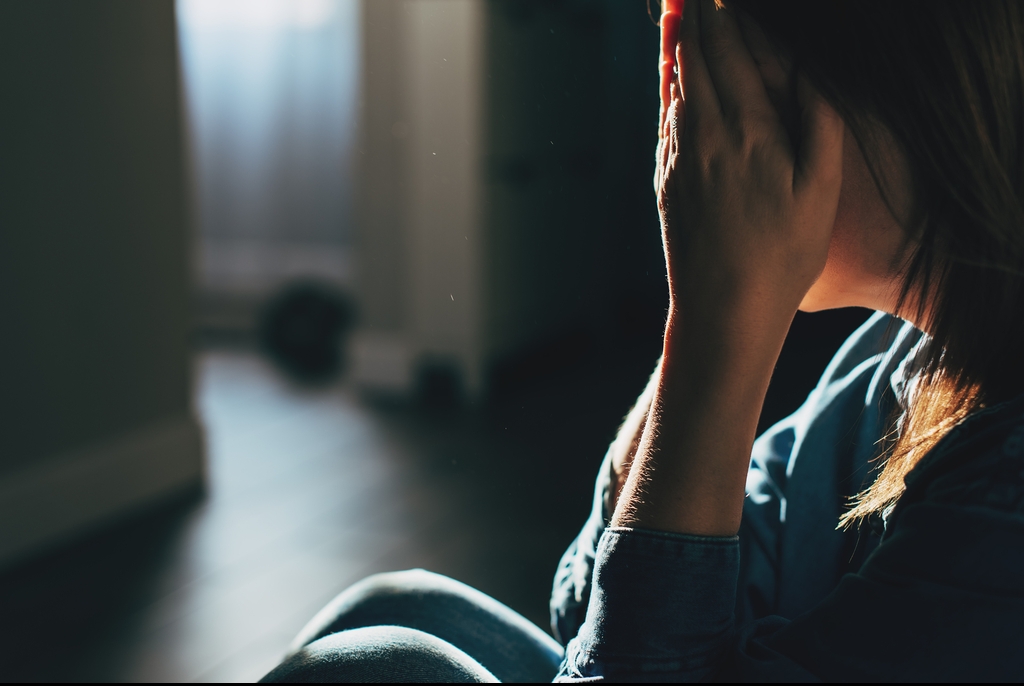 Woman crying alone.