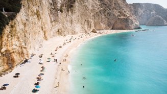 Woman's 'petty' revenge on couple who sat in front of her at the beach divides social media users