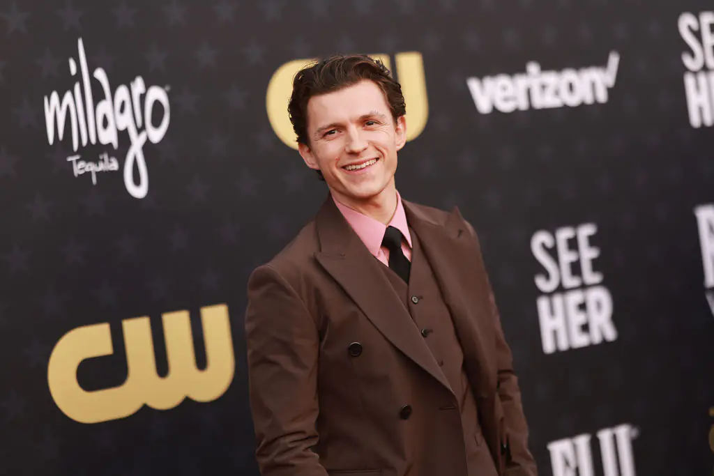 Tom Holland explains why he doesn't stand next to Zendaya at red carpet events