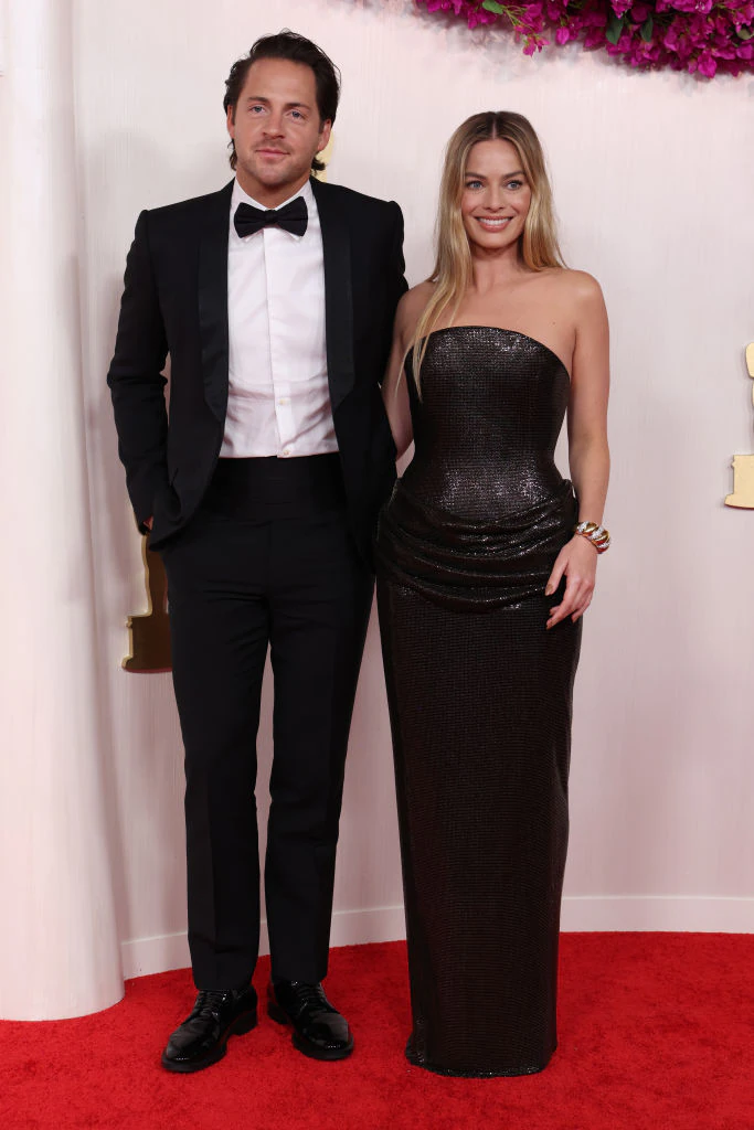 Tom Ackerley and Margot Robbie. Credit: Kevin Mazur / Getty
