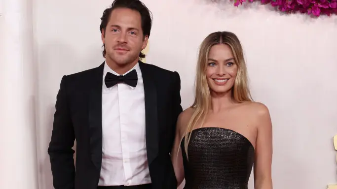HOLLYWOOD, CALIFORNIA - MARCH 10: (L-R) Tom Ackerley and Margot Robbie attend the 96th Annual Academy Awards on March 10, 2024 in Hollywood, California. (Photo by Kevin Mazur/Getty Images)