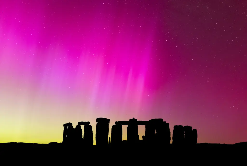 The Northern Lights over Stonehenge, England. Credit: Anton Petrus/Getty