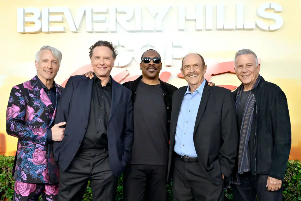 Ashton with the cast of Beverly Hills Cop: Axel F. Credit: John Sciull / Getty