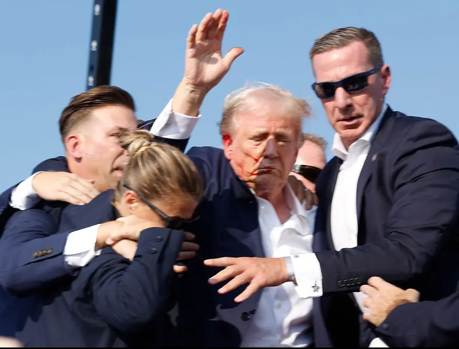 Donald Trump swamped by security amid shooting. Credit: Anna Moneymaker/Getty 