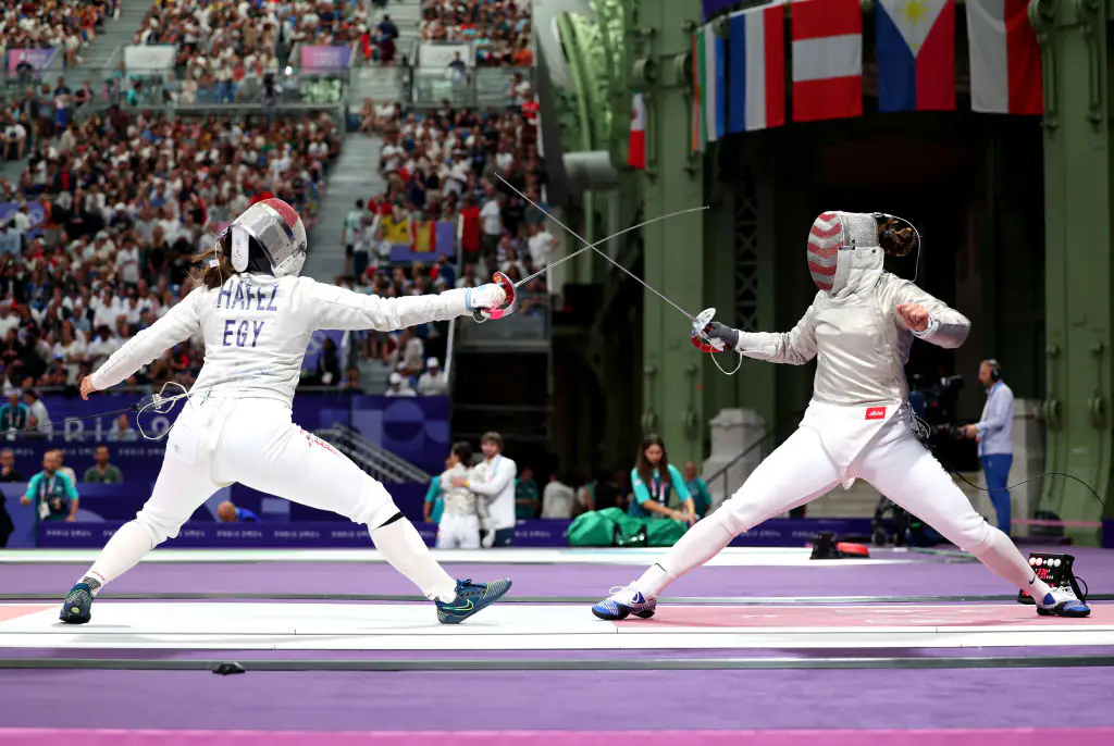 Nada Hafez of Team Egypt competed against Elizabeth Tartakovsky of Team United States in the Fencing Women's Sabre Individual. Credit: Al Bello/Getty