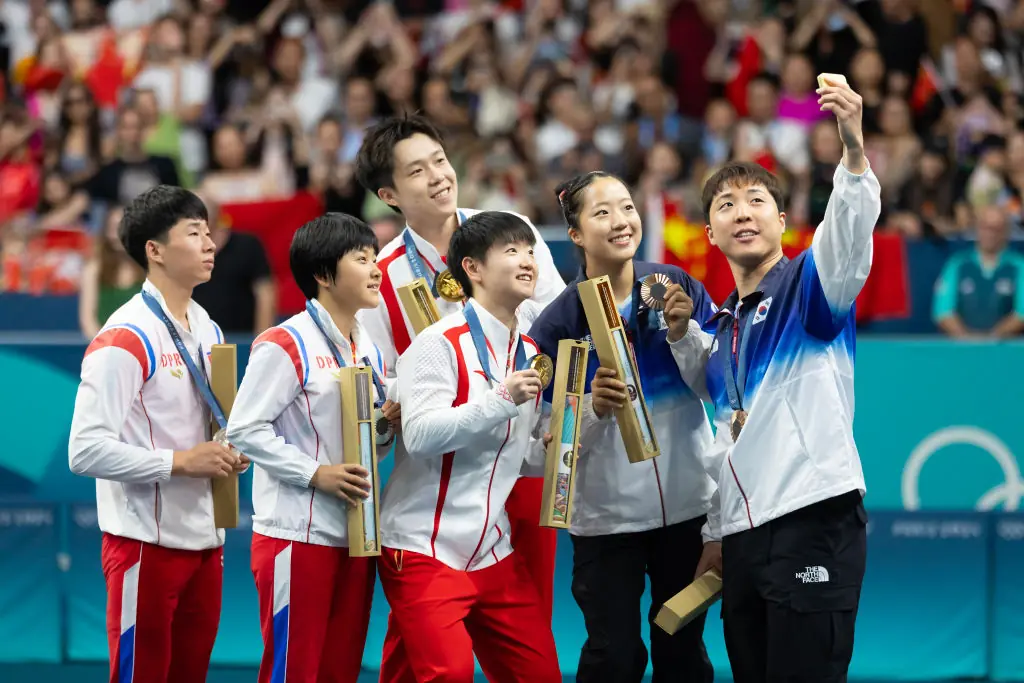 Wang Chuqin and Sun Yingsha, silver medalists North Korea's Ri Jong Sik and Kim Kum Yong, bronze medalists South Korea's Lim Jonghoon and Shin Yubin. Credit: VCG / Getty
