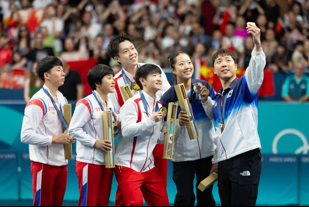 Wang Chuqin and Sun Yingsha, silver medalists North Korea's Ri Jong Sik and Kim Kum Yong, bronze medalists South Korea's Lim Jonghoon and Shin Yubin. Credit: VCG / Getty