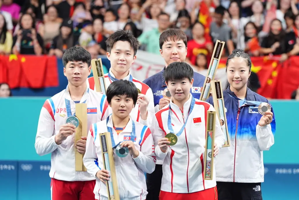 Gold medalists China's Wang Chuqin and Sun Yingsha, silver medalists North Korea's Ri Jong Sik and Kim Kum Yong, bronze medalists South Korea's Lim Jonghoon and Shin Yubin.Credit: China News Service / Getty