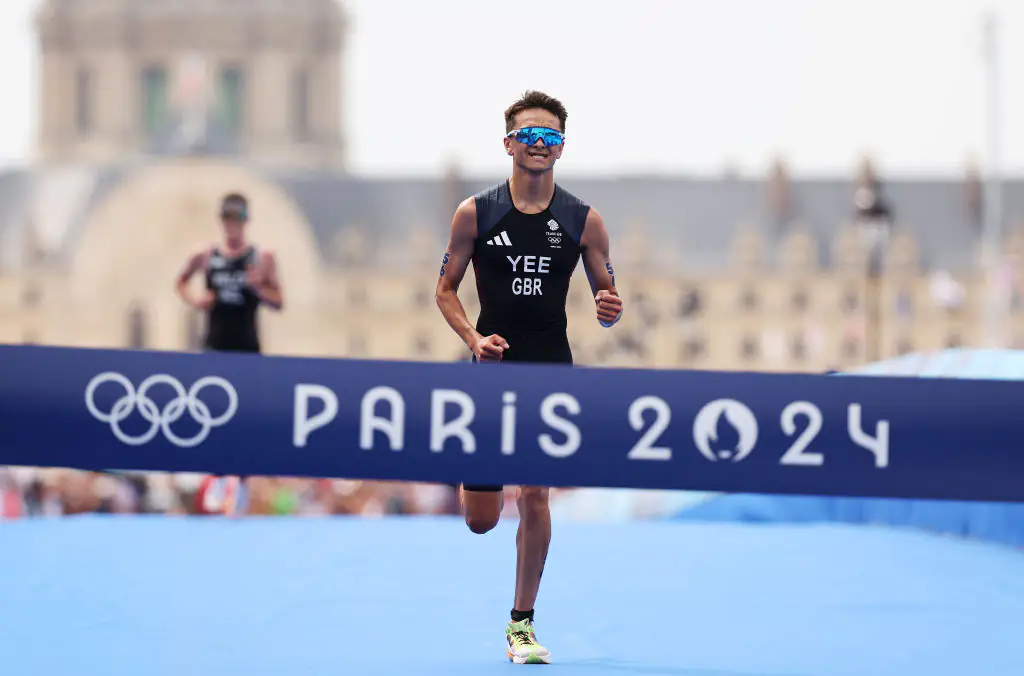 Alex Yee of Team Great Britain crosses the finish line to win gold during the Men's Individual Triathlon. Credit: Ezra Shaw/Getty