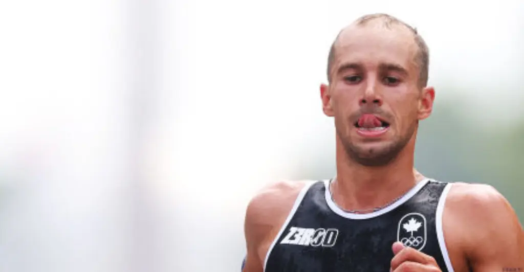 Olympic athlete violently vomits on live television after swimming in polluted Seine river