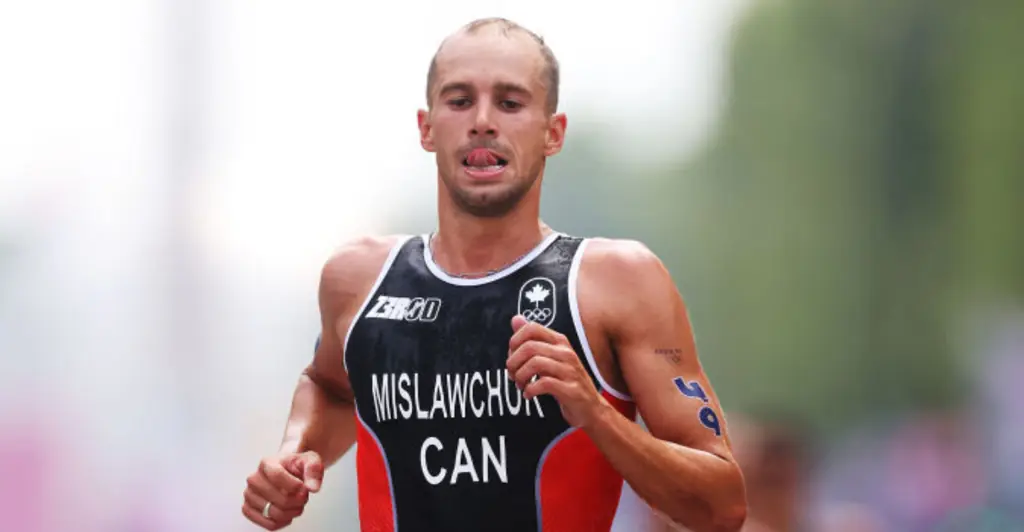 Olympic athlete violently vomits on live television after swimming in polluted Seine river