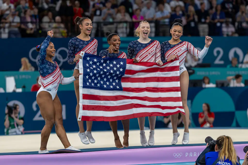 Team USA celebrated their win during the Artistic Gymnastics Team Final for Women. Credit: Tim Clayton/Corbis/Getty