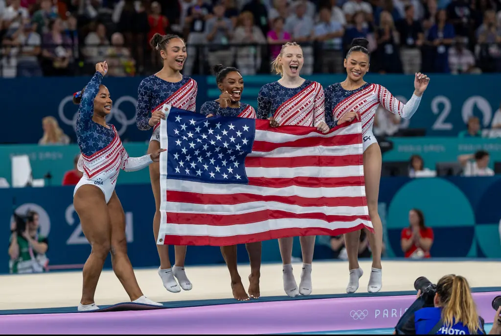 Team USA celebrated their win during the Artistic Gymnastics Team Final for Women. Credit: Tim Clayton/Corbis/Getty