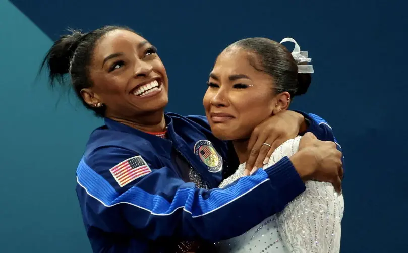Simone Biles and Sunisa Lee support Team USA's Jordan Chiles after she is stripped of bronze medal