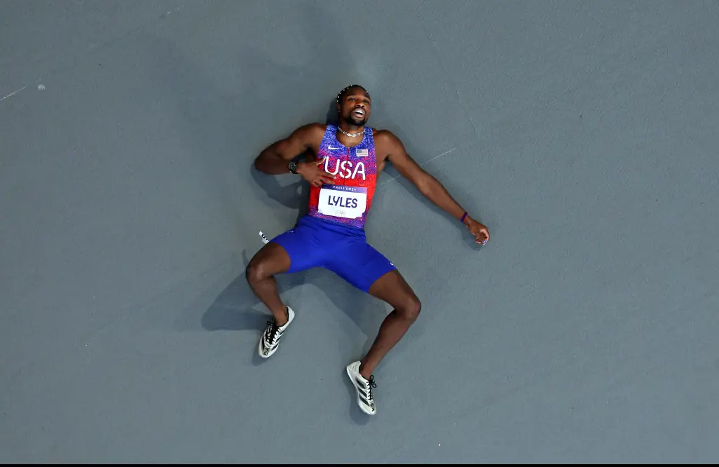 Noah Lyles had collapsed to the ground shortly after crossing the finish line. Credit: Richard Heathcote/Getty Images