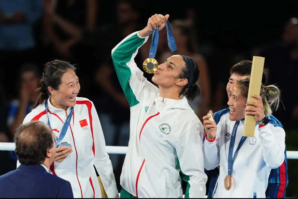 Khelif kissing her gold medal after beating everyone in the Women's 66kg boxing. Credit: Zhao Wenyu/China News Service/VCG/Getty