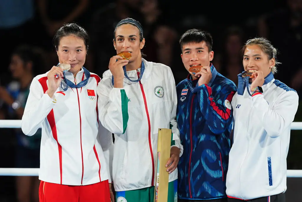 Khelif with silver medalist Yang Liu, and bronze medalists Janjaem Suwannapheng and Chen Nien Chin. Credit: China News Service / Getty