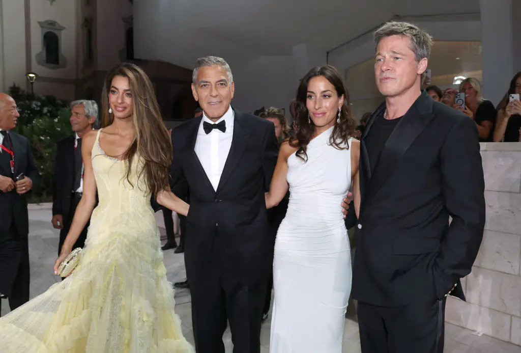 Amal Clooney, George Clooney, Brad Pitt, and Ines de Ramon attend the Wolfs red carpet during the 81st Venice International Film Festival. Credit: Pascal Le Segretain/Getty
