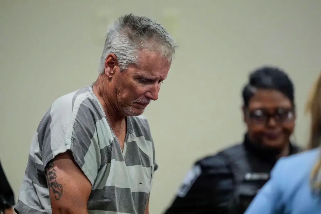 Grandfather of 14-year-old school shooting suspect calls for the teenager's father to face the death penalty