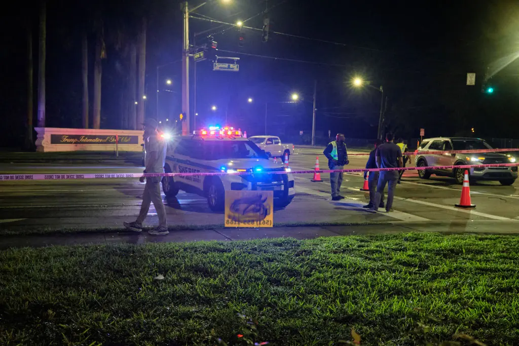 Authorities gather outside of the Trump International Golf Club. Credit: Anadolu / Getty