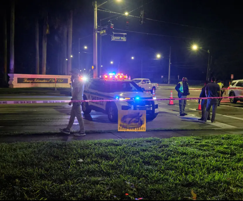 Authorities gather outside of the Trump International Golf Club. Credit: Anadolu / Getty