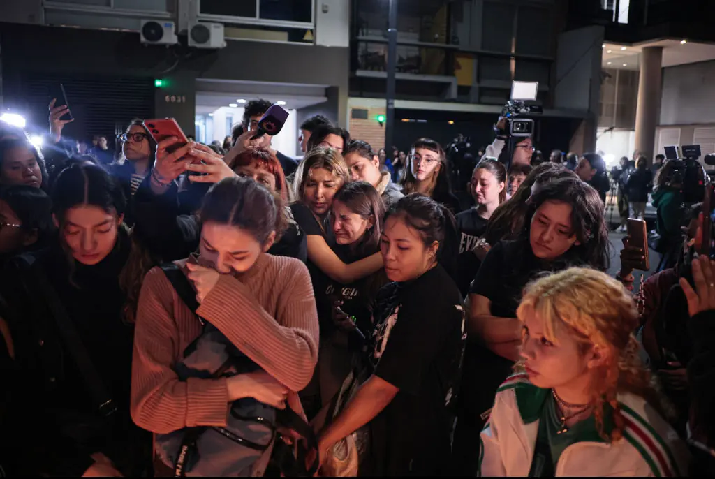 Devastated fans gather outside of the hotel. Credit: Anadolu / Getty