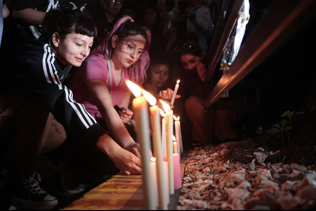 Fans create a vigil outside of the hotel. Credit: Anadolu / Getty