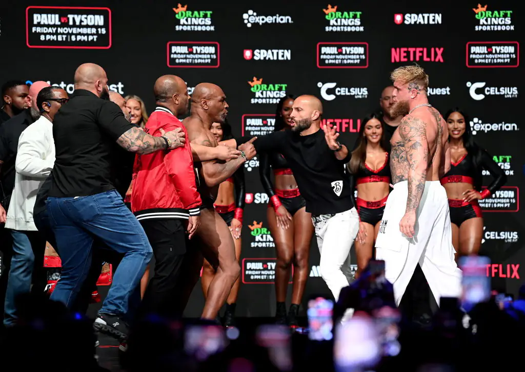 Mike Tyson and Jake Paul had to be separated by security and MVP promotions co-founder Nakisa Bidarian during the weigh-ins. Credit: Stephen McCarthy / Getty