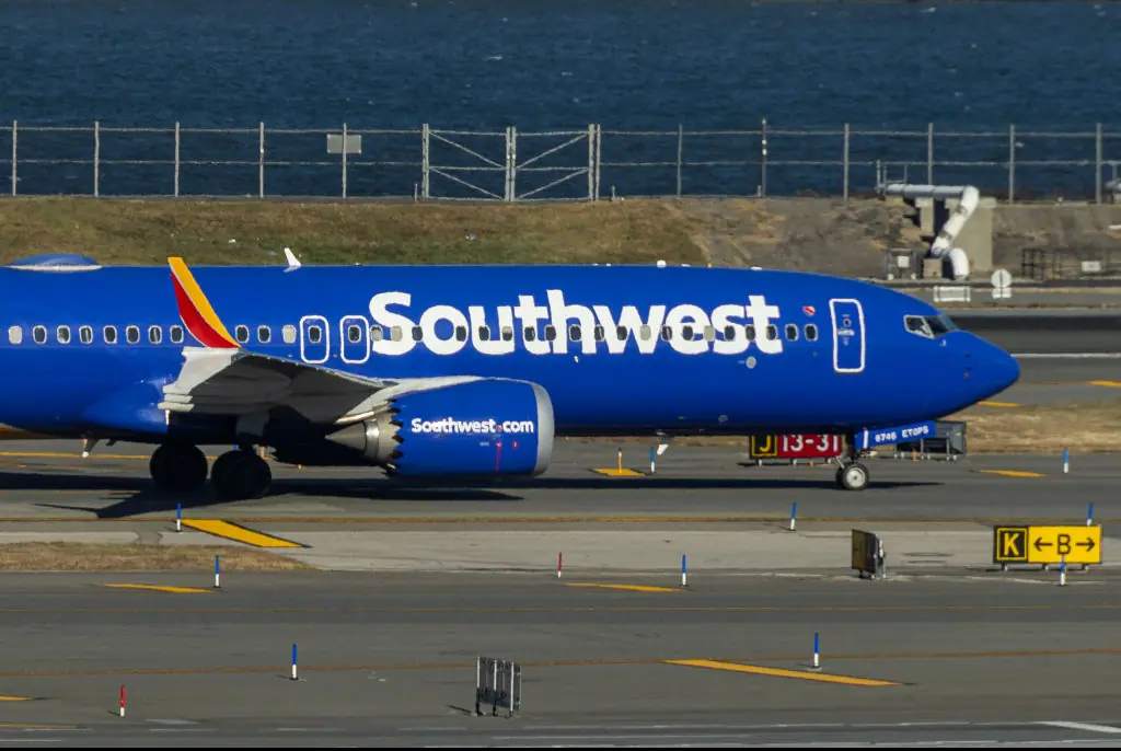 Southwest passengers forced to evacuate smoke-filled plane after 'smartphone and seat catch on fire'
