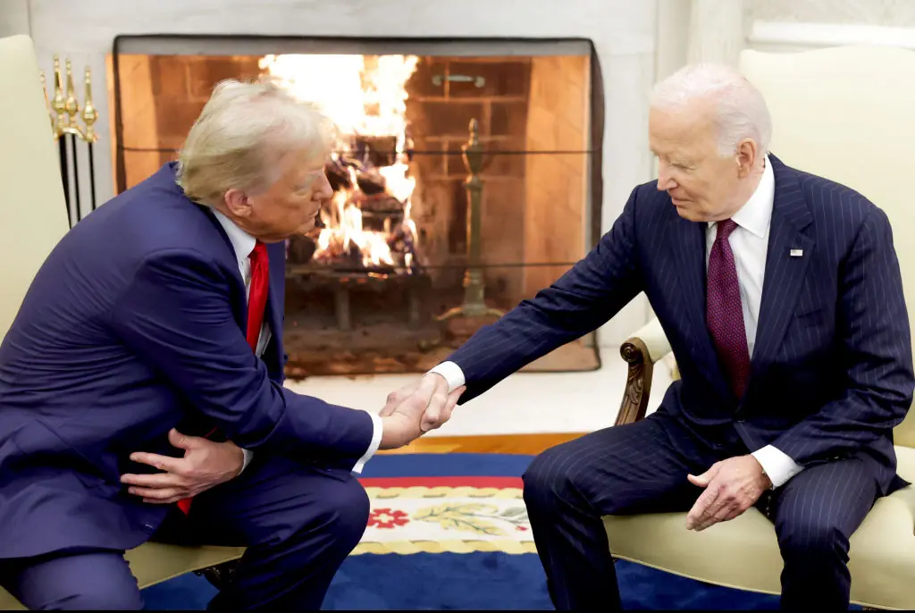 Biden and Trump shared a handshake in front of the fireplace. Credit: Alex Wong / Getty